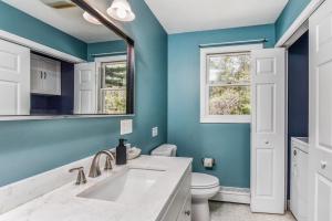 a bathroom with a sink and a toilet at Corn Hill Ranch in Falmouth