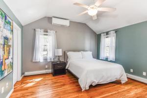 a bedroom with a bed and a ceiling fan at Corn Hill Ranch in Falmouth