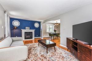 a living room with a couch and a tv at Corn Hill Ranch in Falmouth