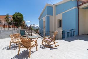 a group of chairs and a table on a patio at Domo Cadò in Berchidda