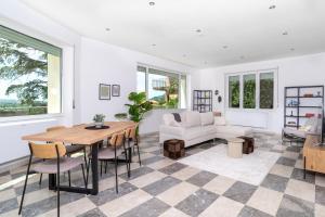 a living room with a table and chairs and a couch at Domo Cadò in Berchidda