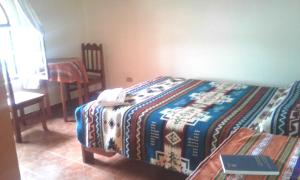 Voodi või voodid majutusasutuse Hostal Curiñan toas