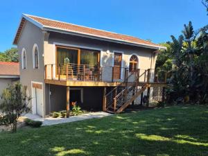 a house with a deck and a yard at 46 Minerva Avenue in Pennington