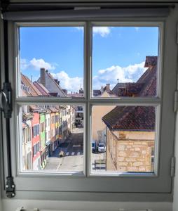 a view from a window of a city street at Le 38-Appart'Hôtel-GregIMMO in Montbéliard