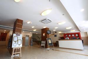 a lobby of a store with a counter in the middle at The HQ in Vasco Da Gama