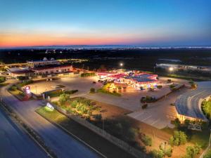 an aerial view of a parking lot at night at Orizzonte MHotel in Andria