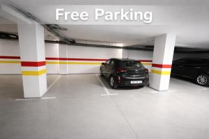 a parking garage with two cars parked in it at Majorelle Elegance City Center - Parking - Balcon in Marrakesh