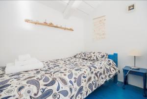 a bedroom with a bed and a blue floor at Villa Aeolus Stylish Villa with Pool Masterbedroom with seperate Mezzanine in Koríthion