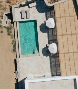 an overhead view of a swimming pool next to a building at Villa Sozon Mykonos in Agios Sostis Mykonos