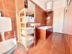 a bathroom with a toilet and a sink at Casa Viola in Balatonfüred