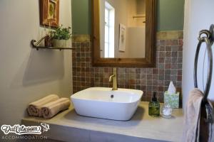 a bathroom with a white sink and a mirror at Suikerbosch Room 1 and Room 2 in Dullstroom