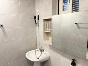 a bathroom with a white toilet and a shower at 깨비하우스201 in Wŏlsan