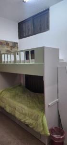 a bunk bed in a room with a green bed at الاردن - جرش in Jerash