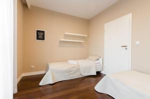 Łóżko lub łóżka w pokoju w obiekcie Old Town Luxury Apartment