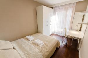 Łóżko lub łóżka w pokoju w obiekcie Old Town Luxury Apartment