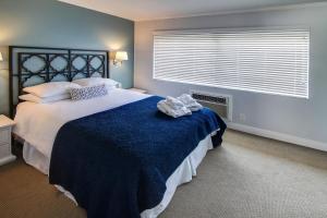 Postel nebo postele na pokoji v ubytování May-Dee Suites in Florida