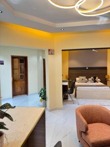 a hotel room with a bed and a desk at Residence MBK Studio 1 in Ziguinchor +43 photos