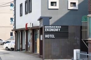 a hotel sign in front of a building at EKonomy Hotel Incheon Bupyeong Branch in Incheon