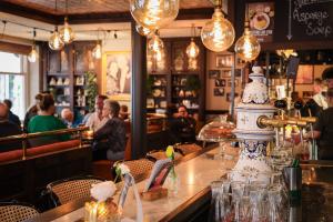 a restaurant with a table with a cake on it at Tiny's Herberg in Woerden