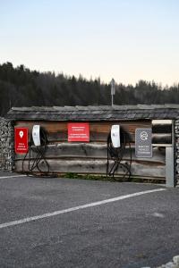 a building with signs on the side of a road at Zbojnicky penzion in Jasenica