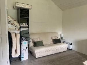 a room with a couch and a bed in a room at Chalet Eden Insolite in Pionnat
