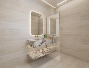 a bathroom with a sink and two mirrors on the wall at The Character in Athens