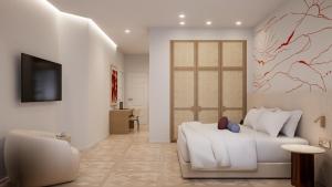 a living room with a white couch and a television at The Character in Athens