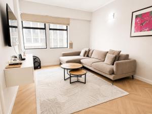 a living room with a couch and a table at Cape Town Panorama Luxe Suite in Cape Town