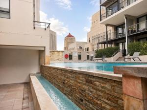 a swimming pool in the middle of a building at Cape Town Panorama Luxe Suite in Cape Town