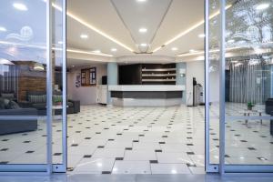 a lobby with a reception desk in a building at Karras Hotel in Laganas +51 photos