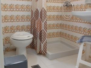 a bathroom with a toilet and a sink and a shower at Hermes in Agia Marina Aegina +39 photos