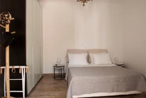 a bedroom with a large bed with white pillows at Chrysalis Nature Villa 4 in Kampos Paros +70 photos
