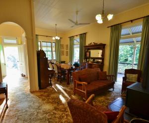 a living room with a couch and a table at Mt Barney Lodge in Barney View