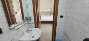 a bathroom with a sink and a shower with a mirror at B&B Sant'Antonio in Gallipoli +18 photos