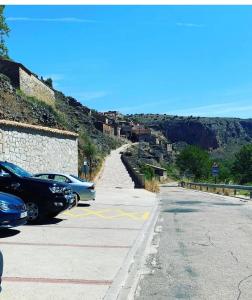 a street with cars parked on the side of a hill at Casa Purujosa in Purujosa