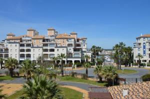 a view of a city with palm trees and buildings at Playa Grande SOLMARES in Isla del Moral