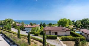 arial view of a house with trees and a driveway at Luxury villas and golf GV6 in Balchik