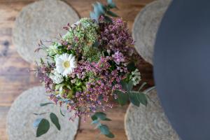 a bouquet of flowers is sitting on a table at Rothen Huus in Norderney