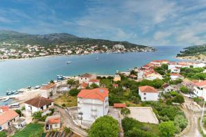 an aerial view of a town next to a body of water at Dzon Beachside Apartments in Vinišće