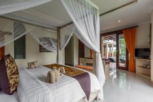 Letto o letti in una camera di Gefecon Villa Ubud