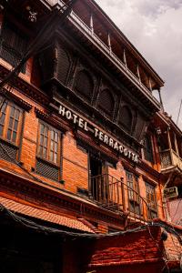 a building with a hotel terrapin sign on it at Hotel Terracotta in Bhaktapur