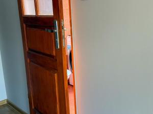 an open door to a laundry room with a door at 11 smart by LibertaRent in Wałbrzych