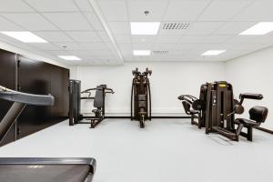 a gym with several treadmills and exercise machines at Ski Chalet C27 Levi Center incl 2 ski passes by Aavalevi in Levi