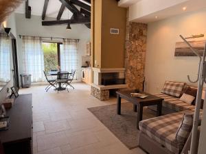 a living room with a couch and a table at Luxury villas and golf GV6 in Balchik