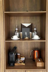 a wooden shelf with a coffee maker and a tea kettle at Pana Unique Kolsay in Kurmenty