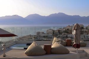 a living room with a view of a city at Mistral Bay Hotel in Agios Nikolaos