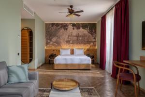 a living room with a bed and a couch at The Wine Station in Tsinandali +44 photos