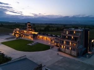 an aerial view of a large building at dusk at The Wine Station in Tsinandali