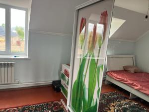 a mirror in a room with a bed and a bed at Aimir in Akchiy