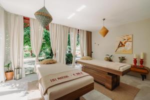 a bedroom with two beds and a large window at Lill Maison Hotel & City Club in Fethiye +51 photos